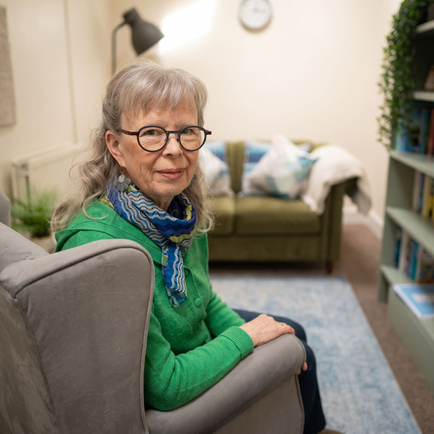 Alison seated in an armchair in her practice room at Chapter House